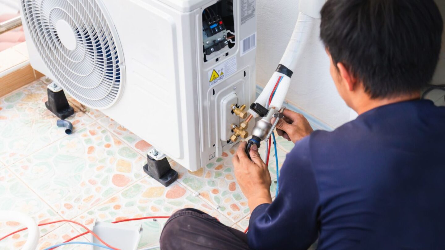 Technician Installing A Mini-split HVAC System